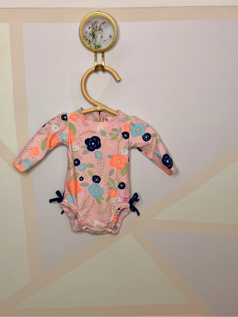 Ruffle Butts Pink Floral Long-Sleeve Swim Bodysuit with Navy Bows